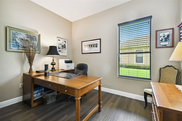 office with a healthy amount of sunlight and dark hardwood / wood-style floors