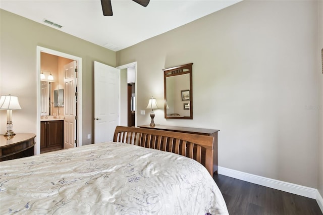 bedroom featuring connected bathroom, dark wood-type flooring, and ceiling fan