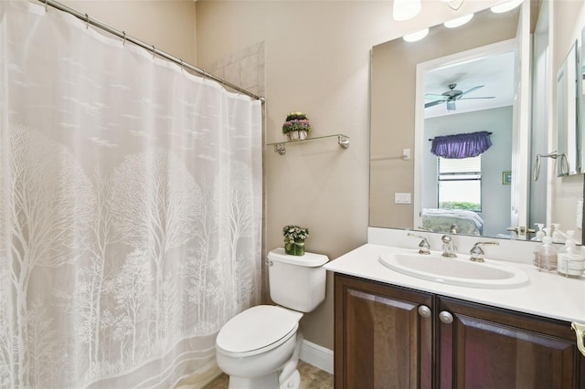 bathroom featuring vanity, ceiling fan, and toilet