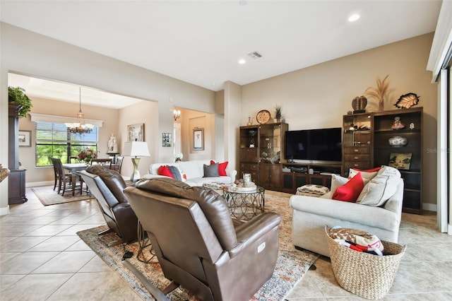 tiled living room with a chandelier