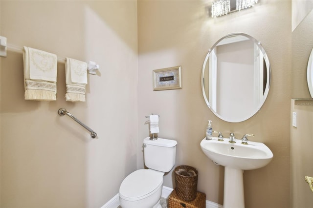 bathroom featuring sink and toilet