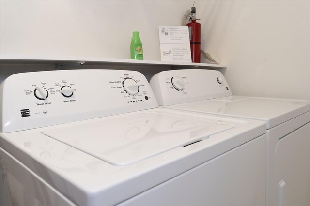 laundry area with independent washer and dryer