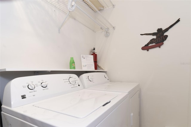 laundry room featuring washing machine and clothes dryer