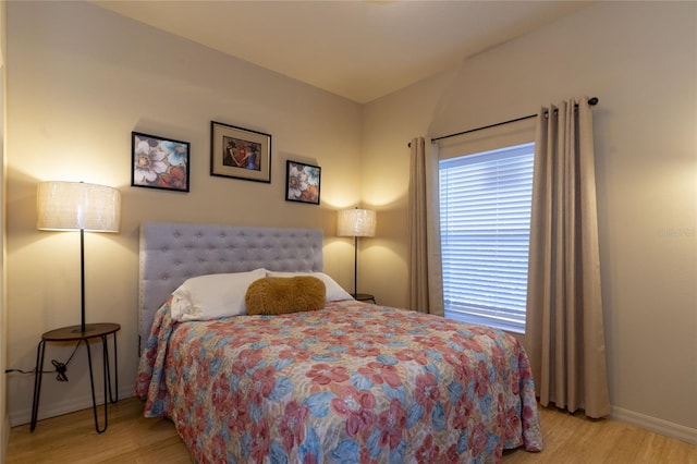 bedroom with light hardwood / wood-style floors