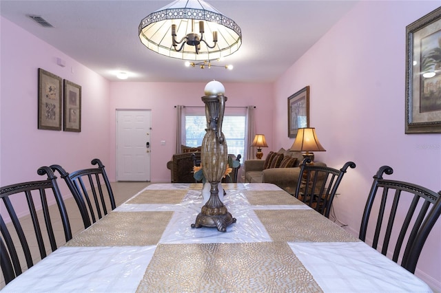 dining space featuring a chandelier