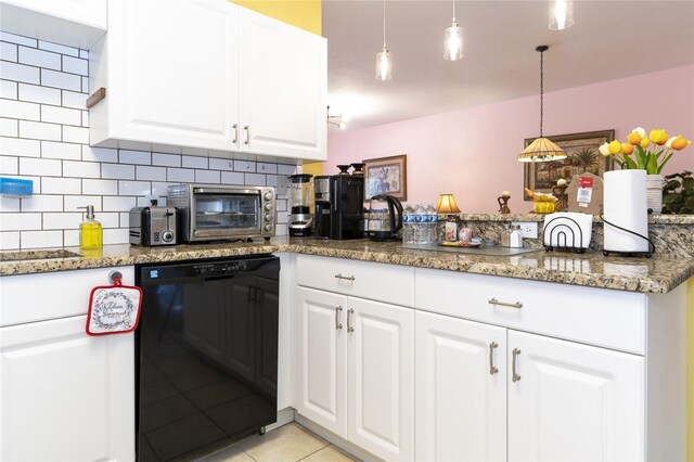 kitchen featuring light tile patterned floors, dark stone countertops, black dishwasher, and white cabinetry