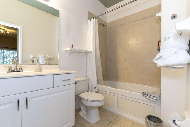 full bathroom featuring tile patterned floors, vanity, toilet, and shower / bath combo