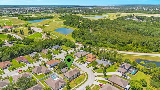 drone / aerial view with a water view