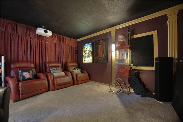 home theater room featuring a textured ceiling, carpet floors, and ornamental molding