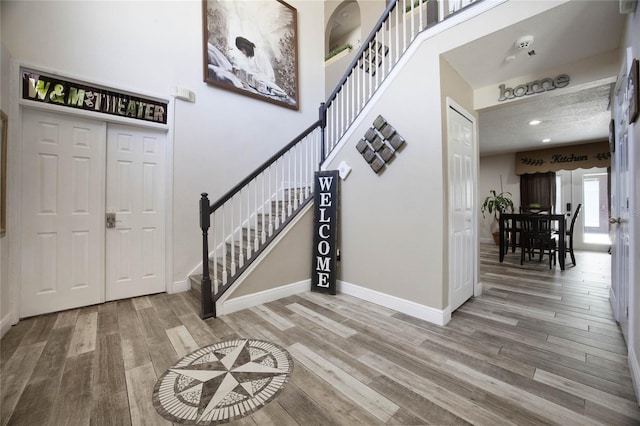 entrance foyer featuring hardwood / wood-style floors and a textured ceiling