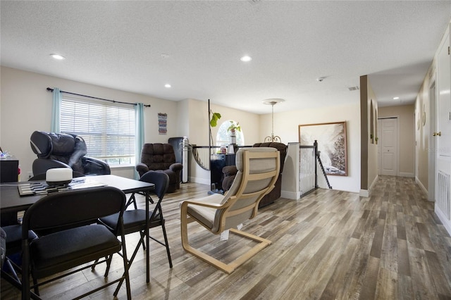 office featuring hardwood / wood-style floors and a textured ceiling