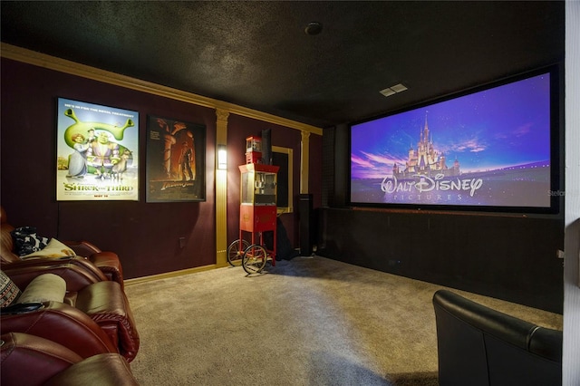 cinema with carpet flooring, ornamental molding, and a textured ceiling