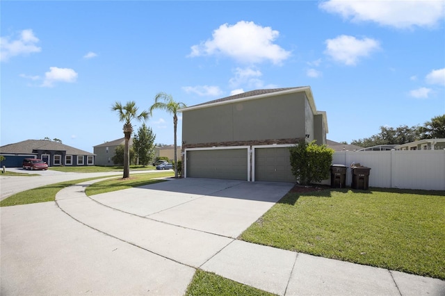 view of front facade featuring a front yard and a garage