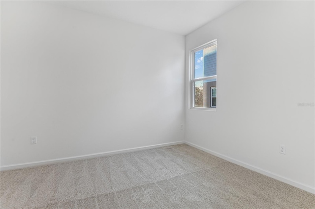 unfurnished room featuring carpet flooring