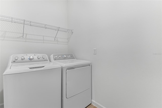 clothes washing area with washer and dryer