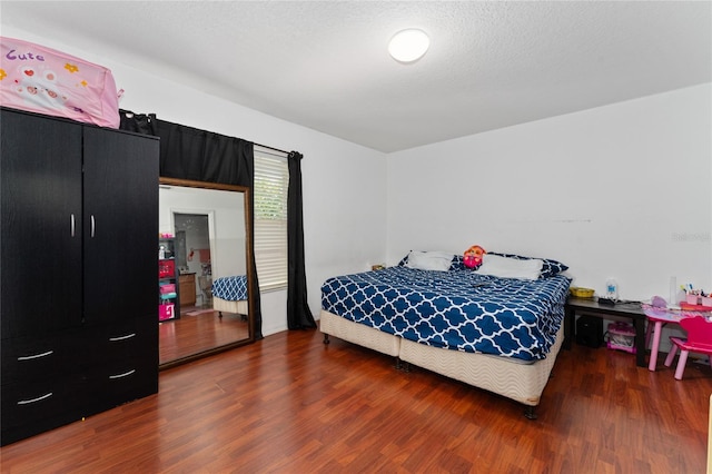 bedroom featuring hardwood / wood-style floors