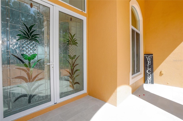 view of exterior entry featuring french doors