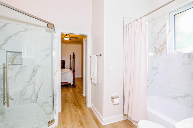 bathroom featuring wood-type flooring and toilet