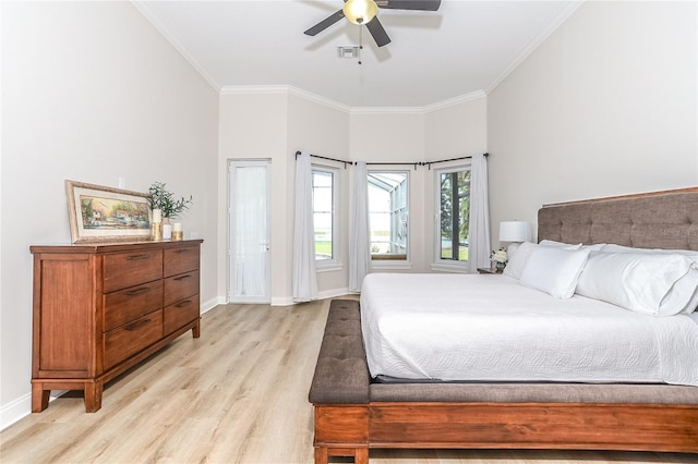 bedroom featuring crown molding, ceiling fan, and light hardwood / wood-style floors