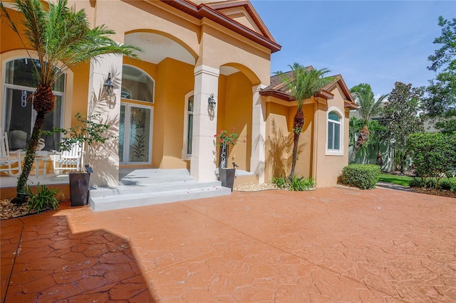 doorway to property featuring a patio