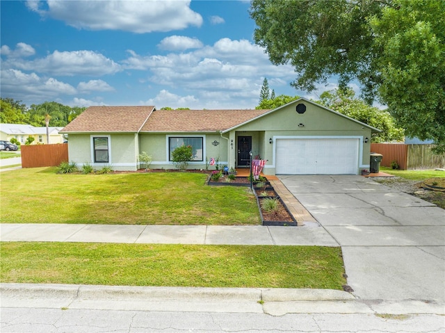 ranch-style house with a garage and a front lawn