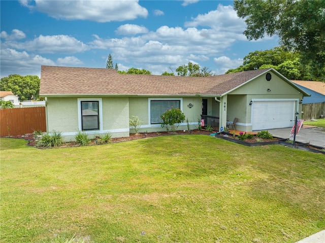 ranch-style home with a garage and a front yard