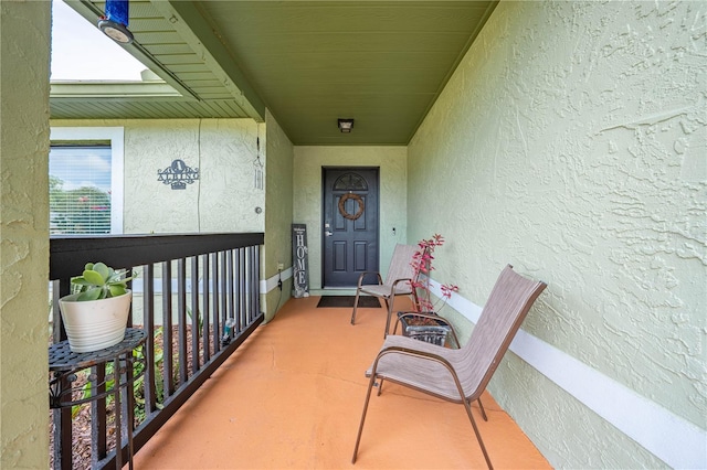 property entrance with a balcony