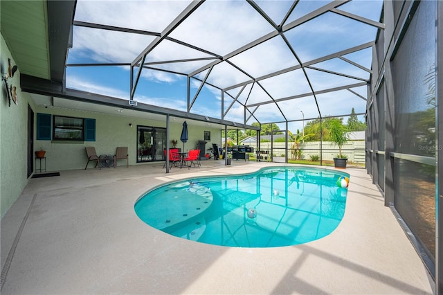 view of pool with a patio and a lanai