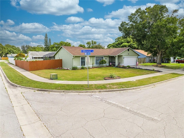 single story home with a garage and a front yard