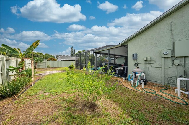 view of yard with a lanai