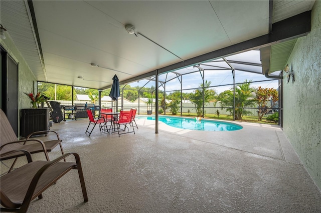 view of pool with a lanai and a patio area