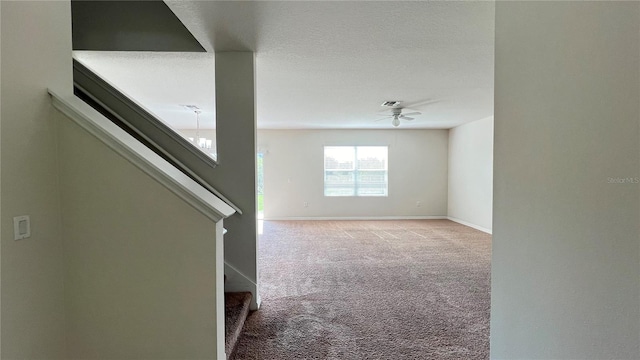 empty room featuring light carpet and ceiling fan