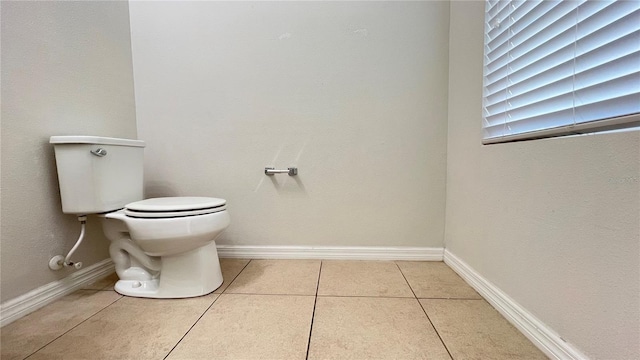 bathroom featuring tile patterned floors and toilet