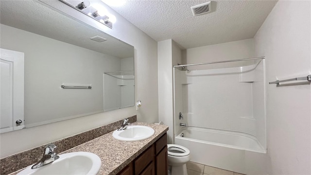 full bathroom with shower / tub combination, a textured ceiling, vanity, tile patterned floors, and toilet