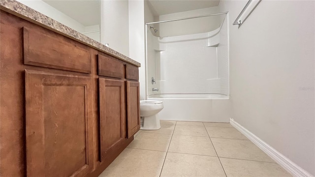 bathroom with tile patterned flooring, toilet, and bathtub / shower combination