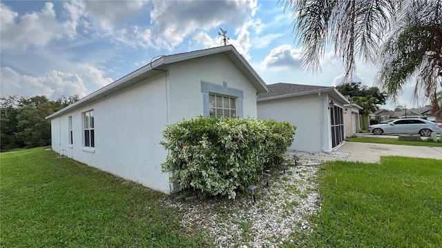 view of side of home featuring a yard