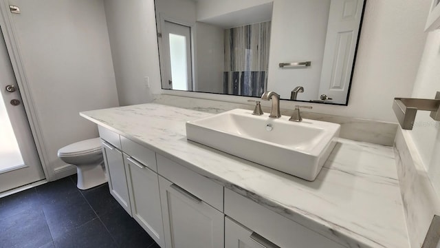 bathroom with vanity and toilet