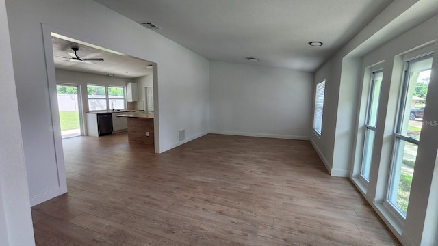 unfurnished room featuring ceiling fan and light hardwood / wood-style flooring