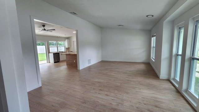 spare room with ceiling fan and light hardwood / wood-style floors