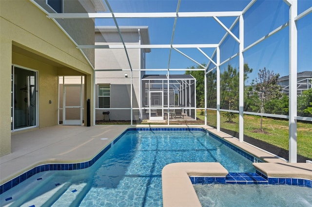 view of pool with a lanai and a patio area