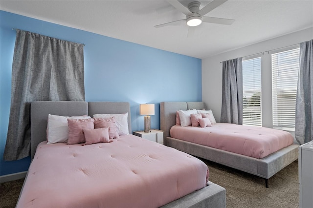 carpeted bedroom featuring ceiling fan