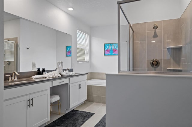 bathroom with vanity, tile patterned flooring, and separate shower and tub