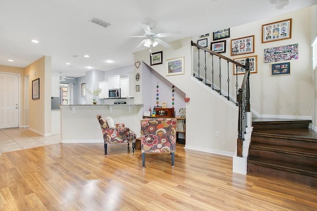 interior space featuring ceiling fan and light hardwood / wood-style flooring