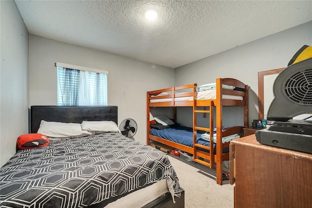 carpeted bedroom with a textured ceiling