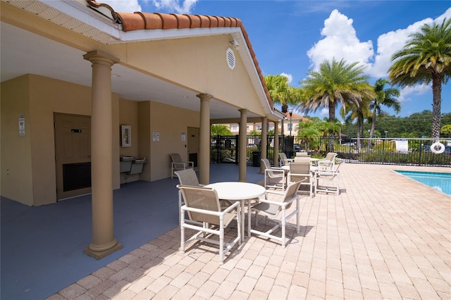 view of patio / terrace featuring a community pool