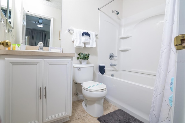 full bathroom with shower / tub combo with curtain, toilet, vanity, and tile patterned flooring