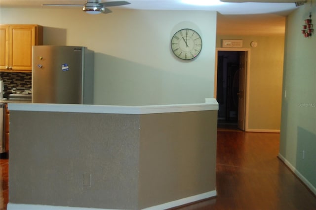 kitchen featuring stainless steel refrigerator, ceiling fan, light brown cabinets, dark hardwood / wood-style flooring, and decorative backsplash