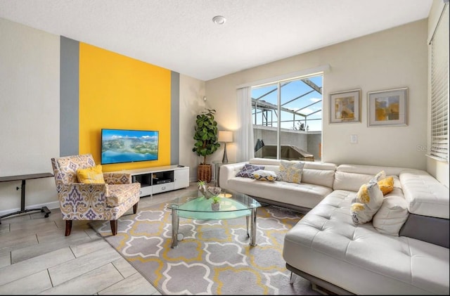 tiled living room featuring a textured ceiling