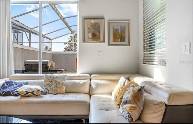 living room featuring lofted ceiling and plenty of natural light