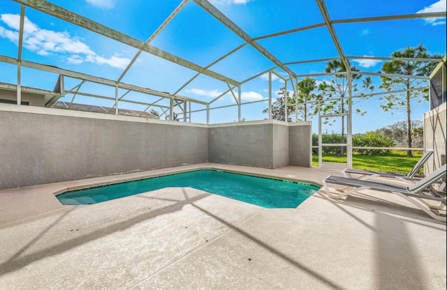 view of pool featuring a lanai and a patio area